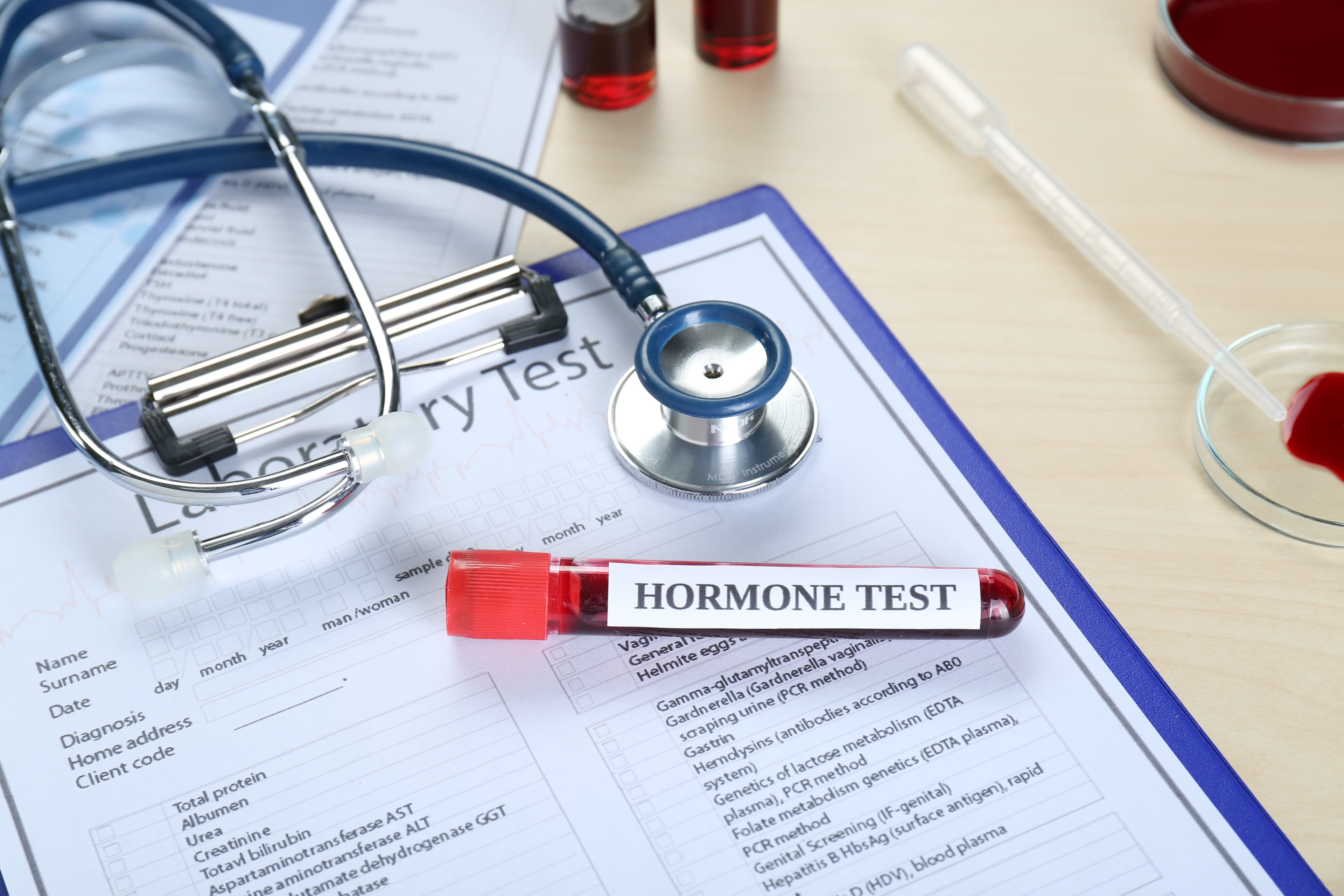 Healthcare provider reviewing hormone test results with a patient